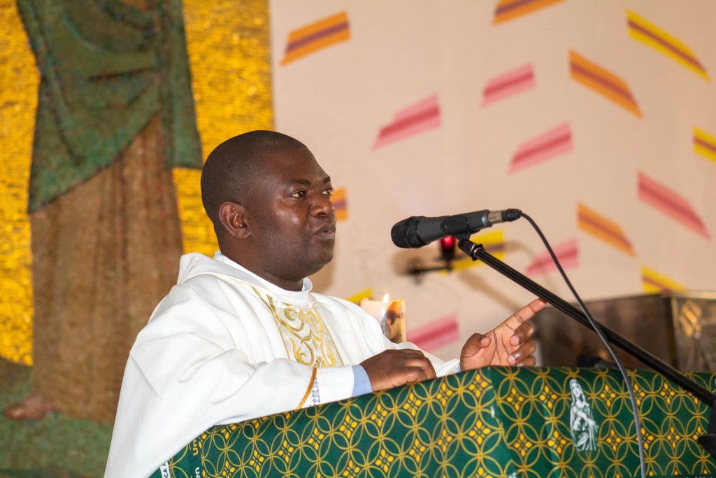 Rev. Fr. Henderson Kumbasa sharing a homily